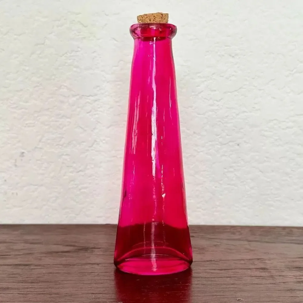 Vintage pink bottle with cork